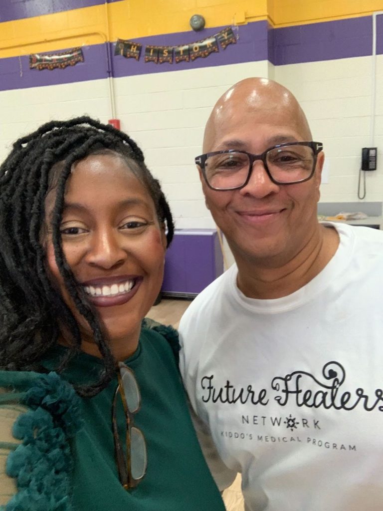 selfie of two people smiling at camera