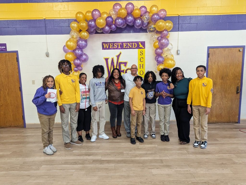 group photo of children with speakers